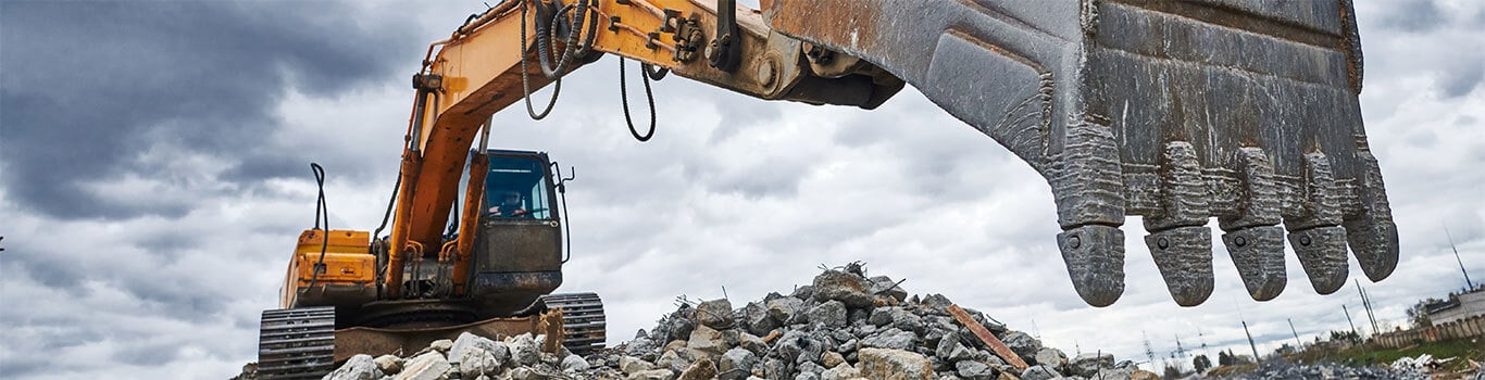 Excavator On Rubble Pile